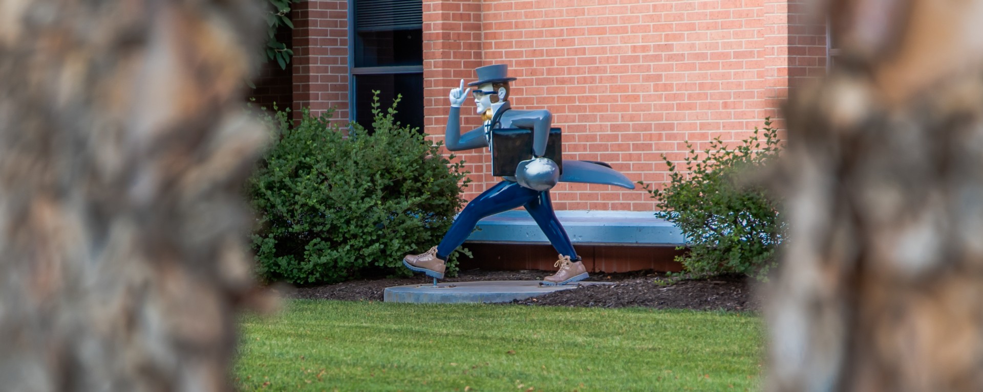 Ichabod statue in front of building