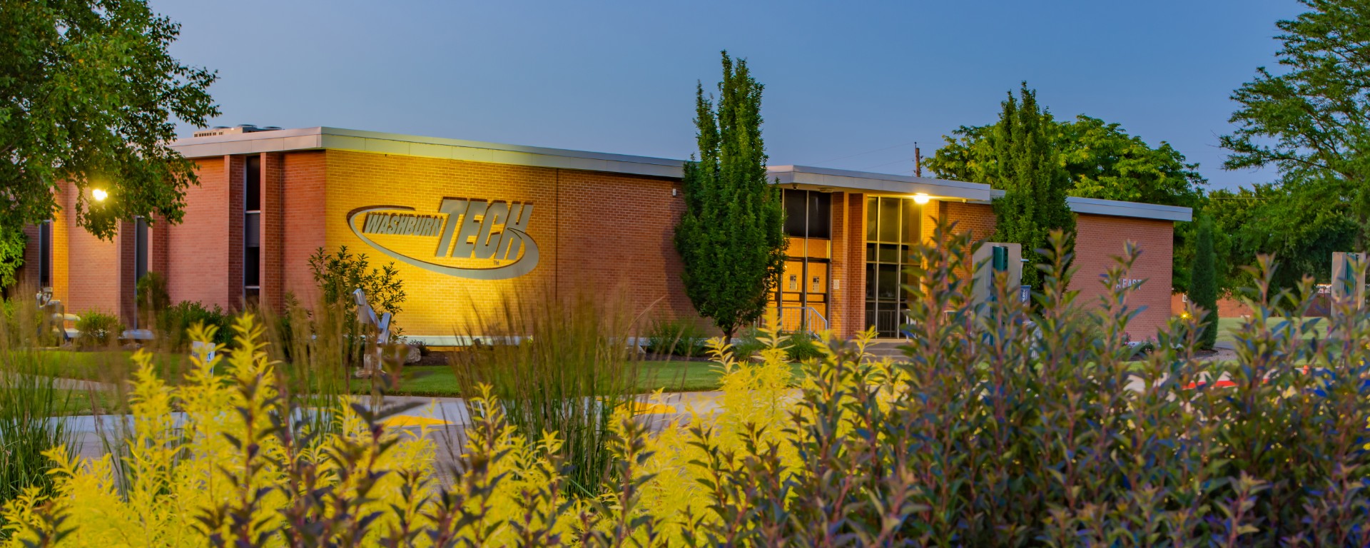 Closeup of Washburn Tech foliage in front of building