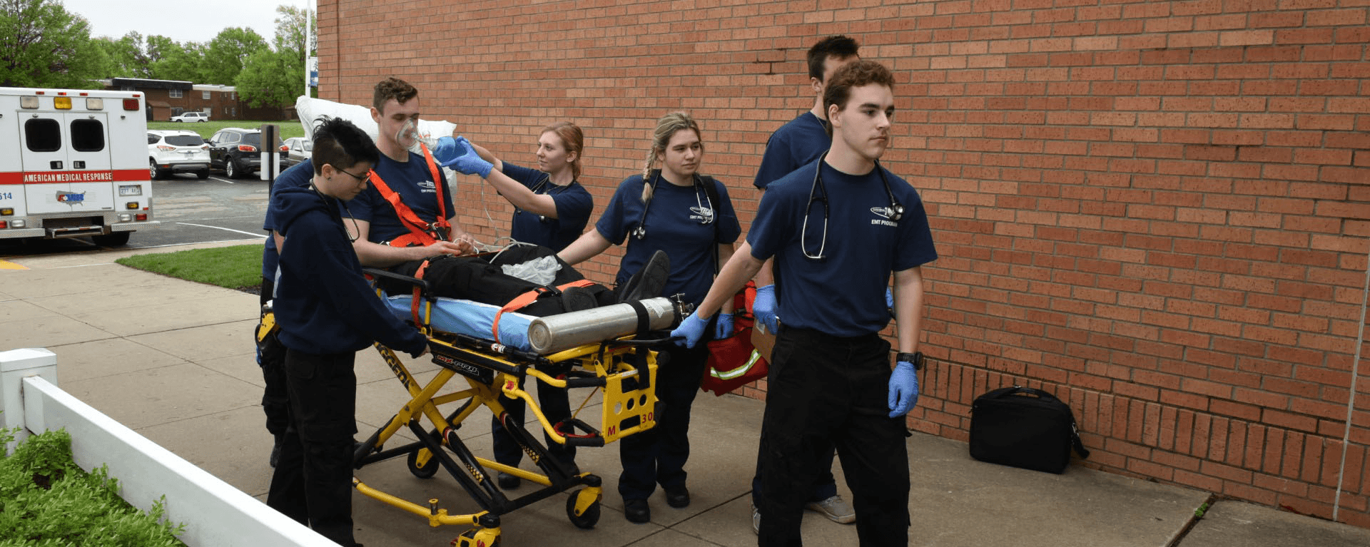 EMT students walking into building