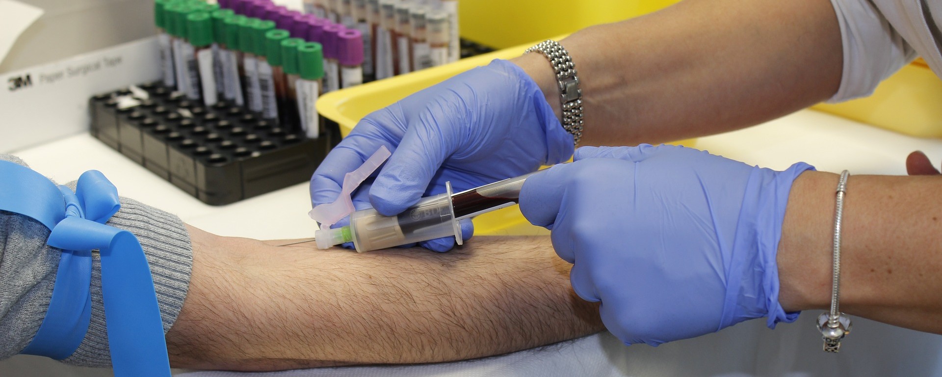 a phlebotomist draws blood