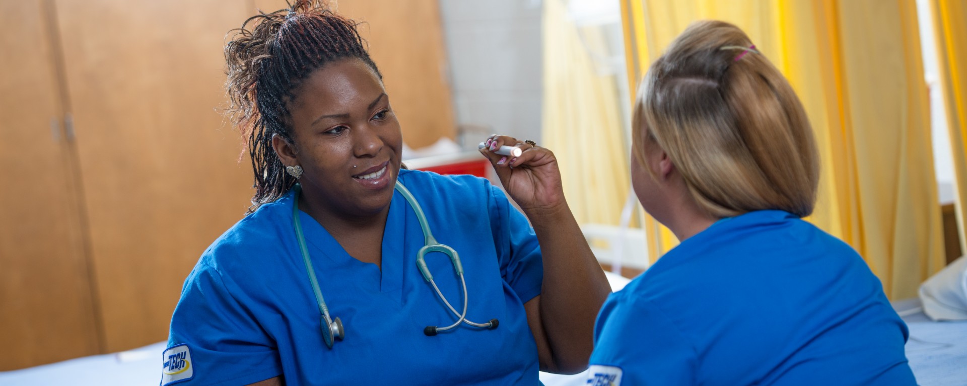 two health care students practice exam