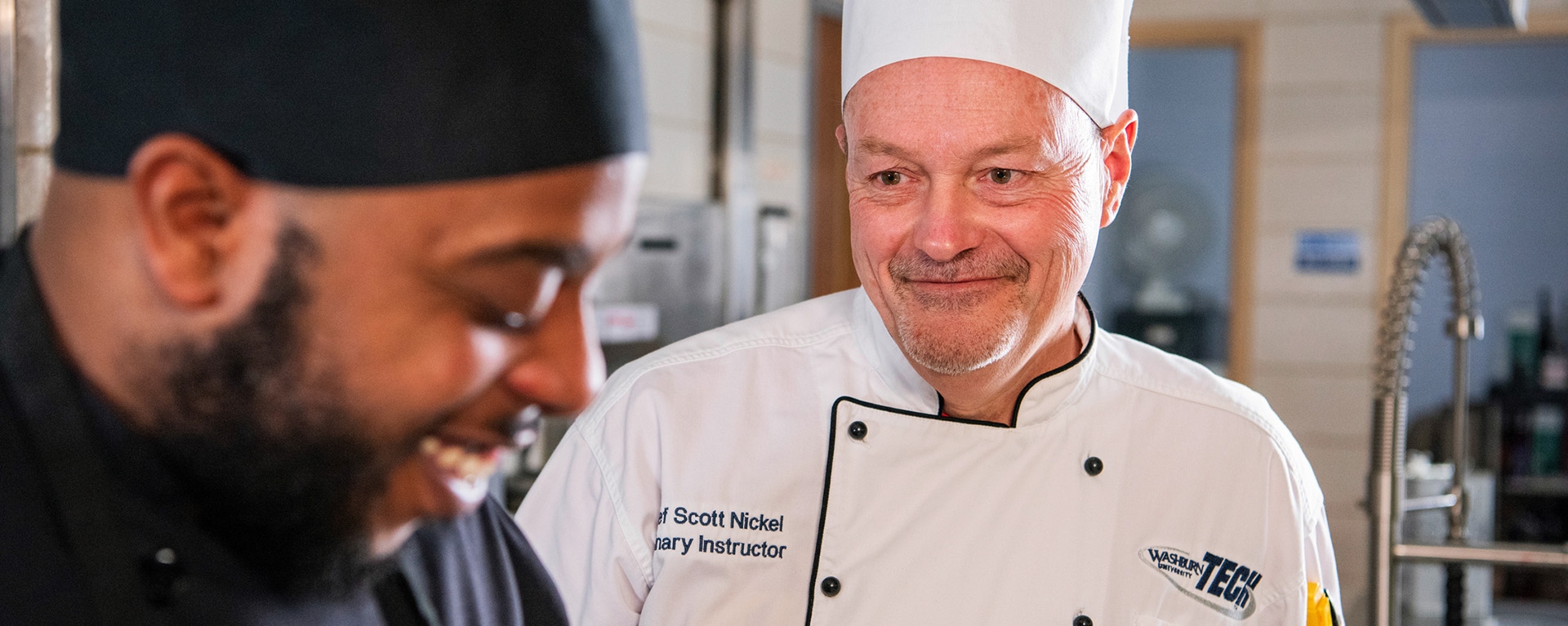 instructor smiling at student