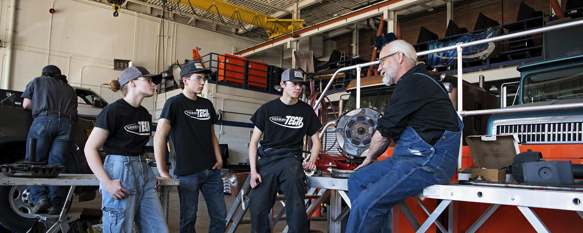 diesel instructor talks with students