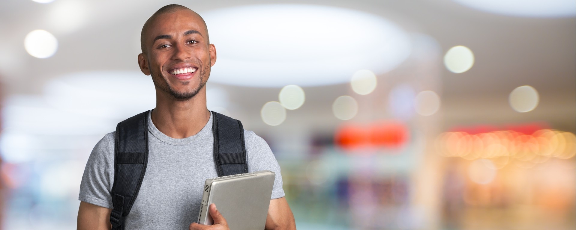 student with a computer