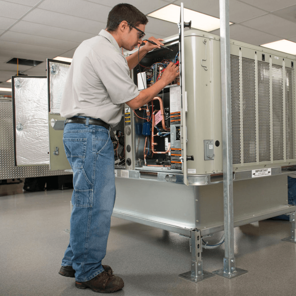 HVAC student working on equipment