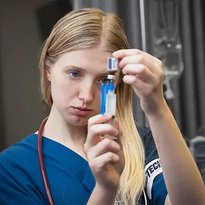 student with syringe