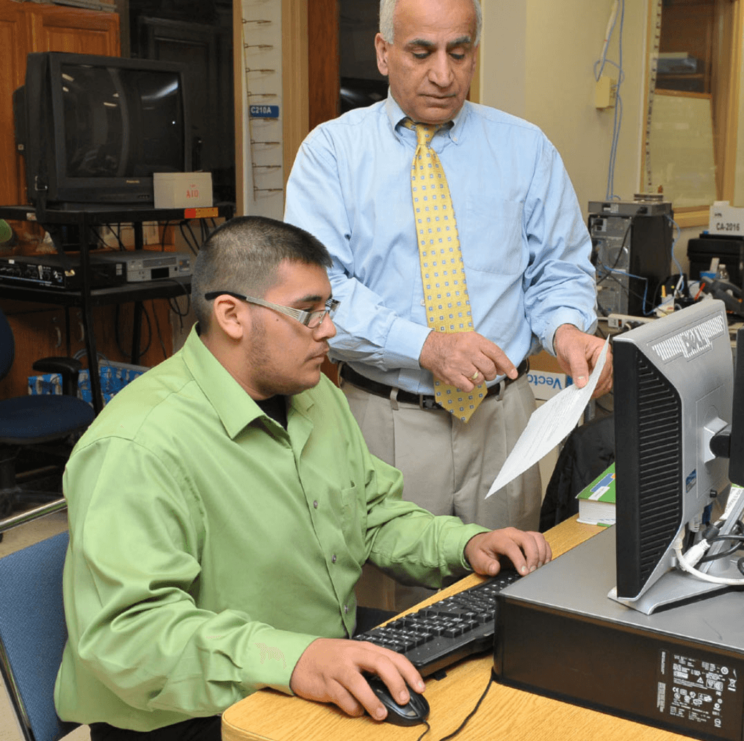 instructor and student in computer lab